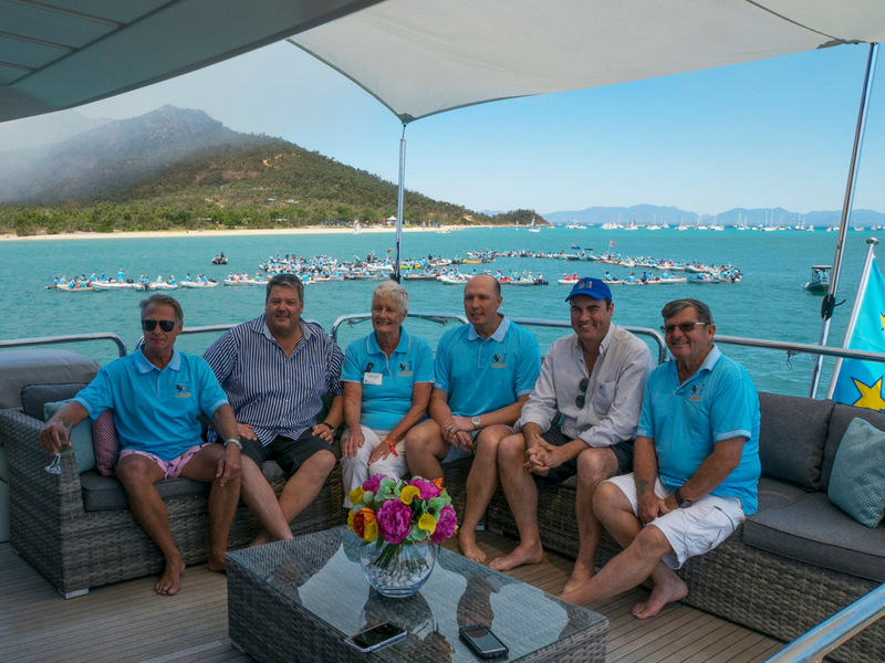 Members of the Shag Islet Cruising Yacht Club Rendezvous celebrating on Paul Darrouzet private vessel Norseman at Hydeaway Bay