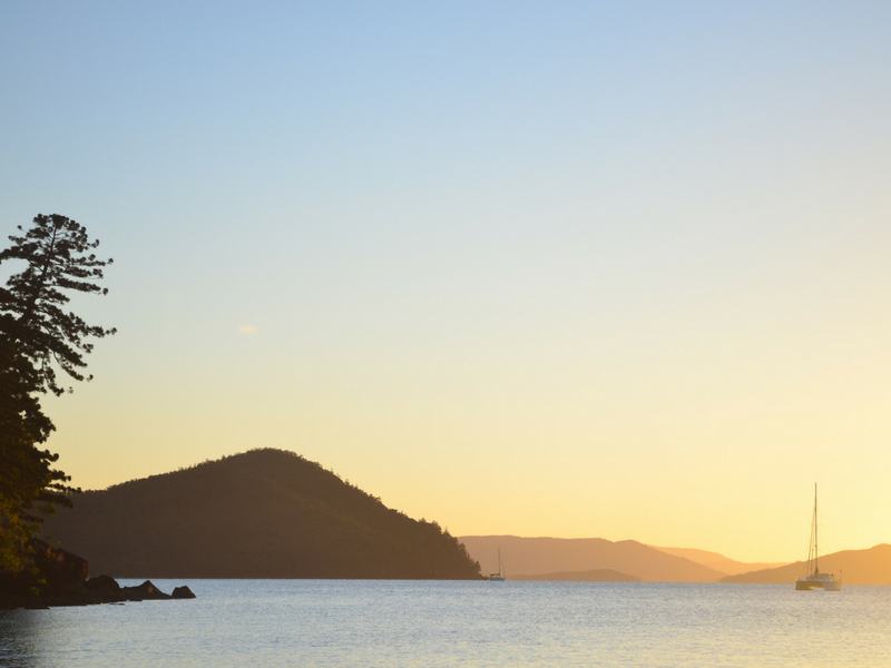 A sunset view over the islands and mainland from Cid Harbour on Whitsunday Island