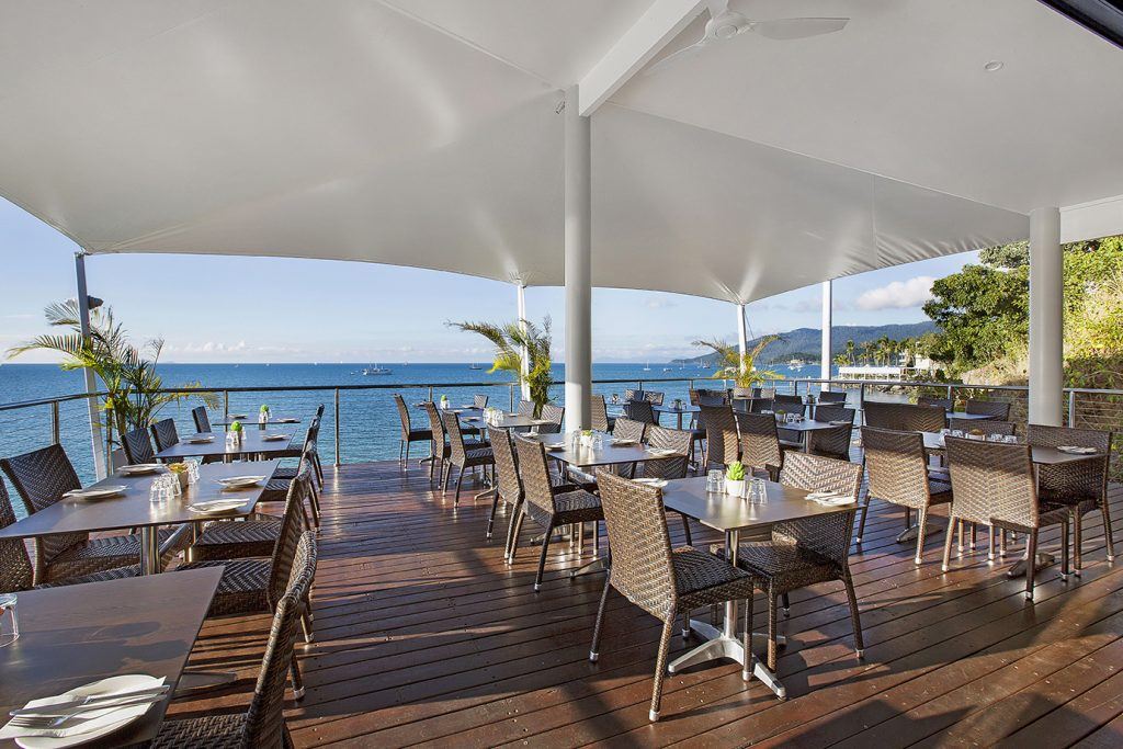 The top ocean view deck at Sorrento restaurant and bar in the north marina village at Coral Sea Marina