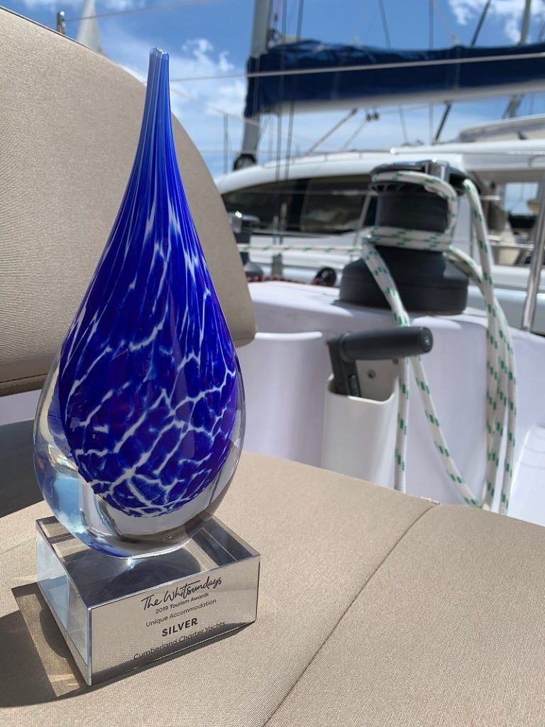 Cumberland Charter Yachts Award trophy on the deck of a yacht