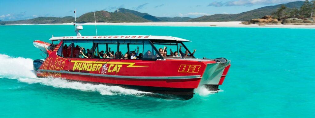 Thundercat speed catamaran from Red Cat Adventures in the Whitsundays on bright blue water