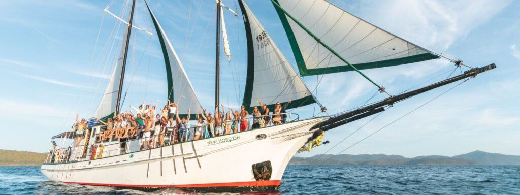 New Horizon sailing vessel with travellers on board in the Whitsundays