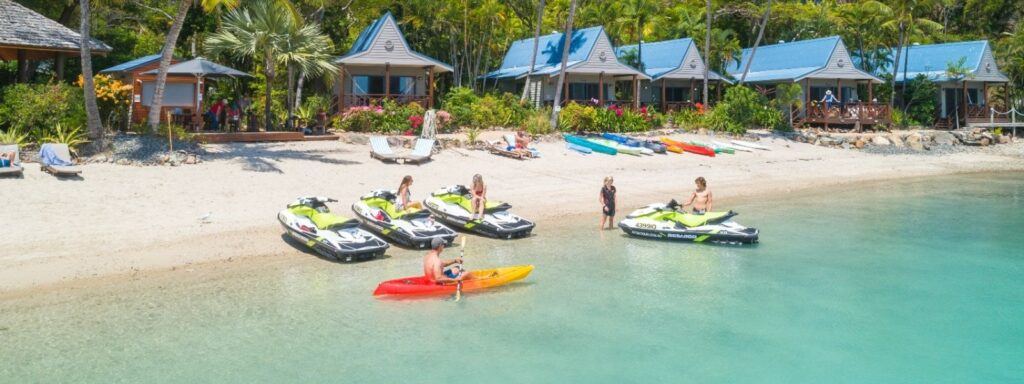 A group of people and Jet Skis at Palm Bay Resort, Long Island in the Whitsundays